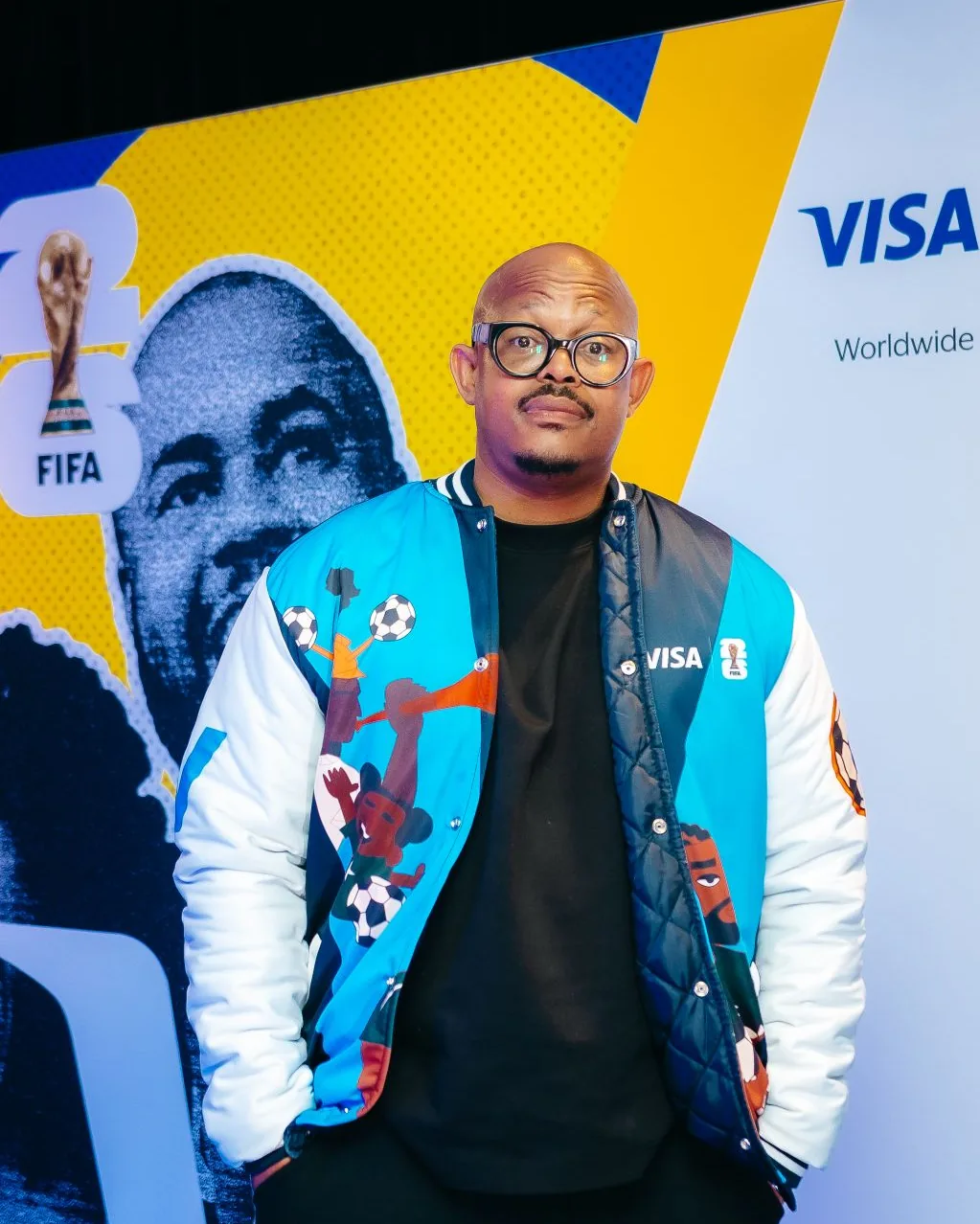 Ndu Donsa in a colourful football jacket at a Visa and FIFA World Cup event